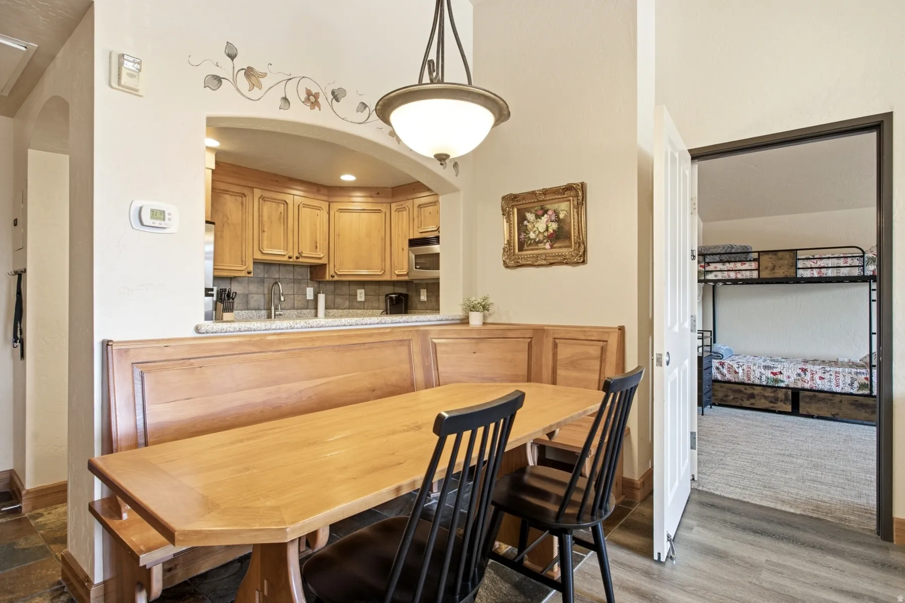 Dining area with built-in wooden banquette seating and coordinating table