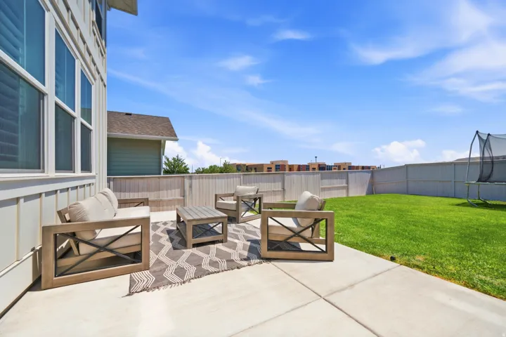 Expansive concrete patio offering exterior seating space