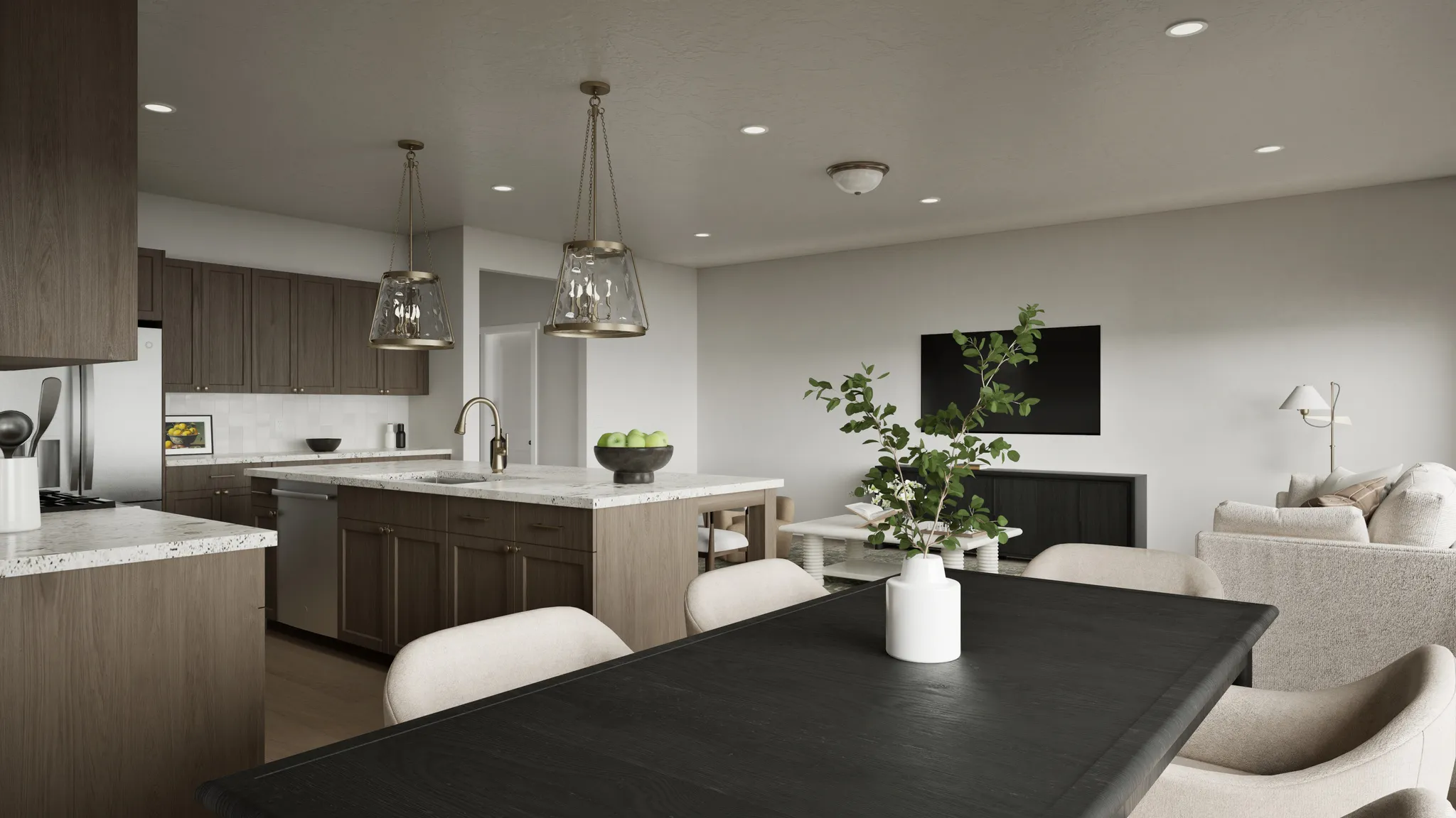 Open-concept living space featuring a kitchen with wood-finish cabinetry, light-toned countertops, and stainless steel appliances