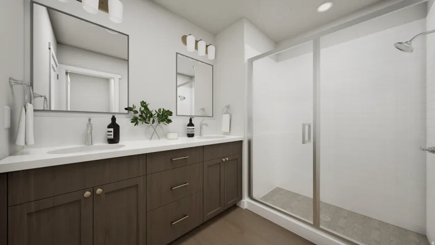 Dual vanity featuring undermount sinks, white countertops, and wood-finish cabinetry