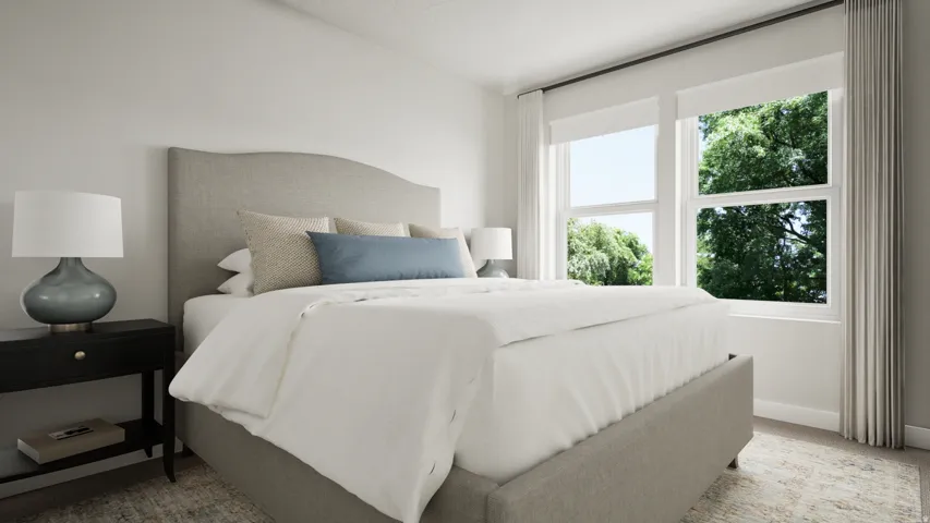 Bedroom featuring light-colored walls and carpet flooring