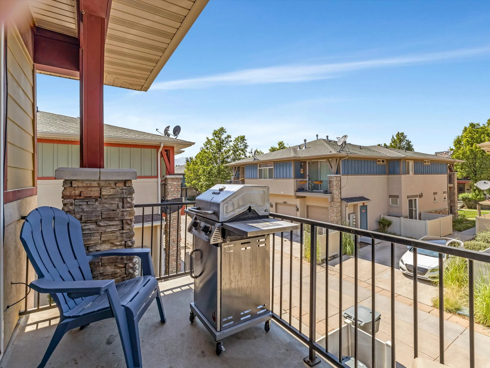 Elevated deck with metal railing and composite decking offers an ideal outdoor entertaining space