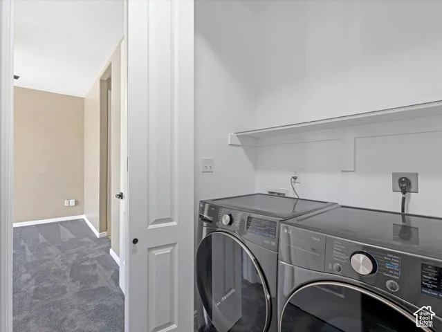 White laundry room with a built-in shelf