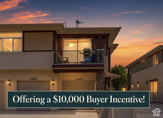 Multi-level exterior featuring a private balcony, integrated garage, and stone accents
