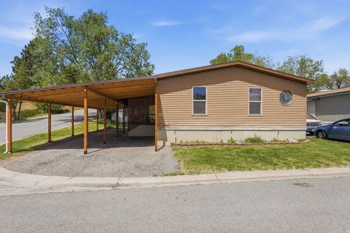 Exterior with horizontal siding and a gambrel-style roof