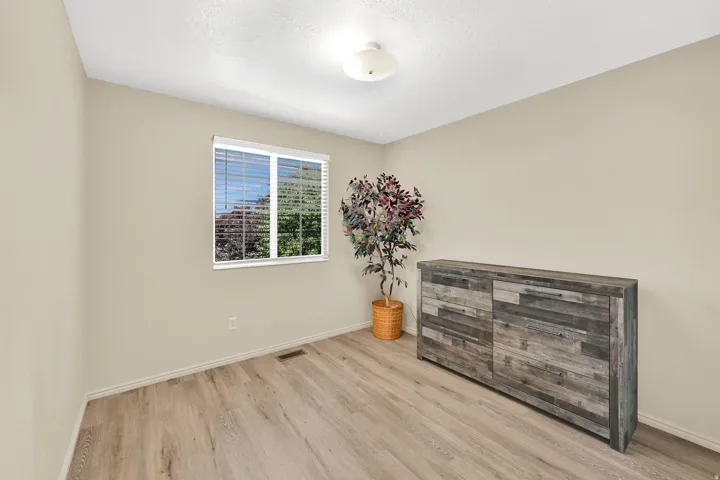 Light-toned walls complement wood-finish flooring