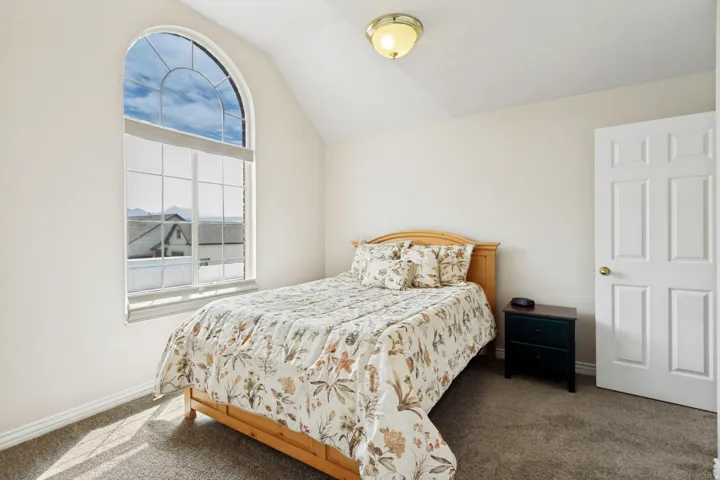 Arched window with upper transom, offering natural light