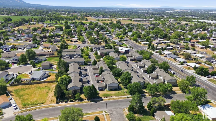 Aerial perspective of a developed residential area with single-family homes and multi-unit buildings