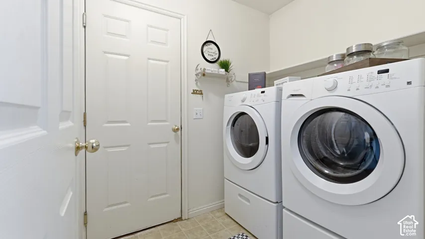 Dedicated laundry area featuring a built-in shelf