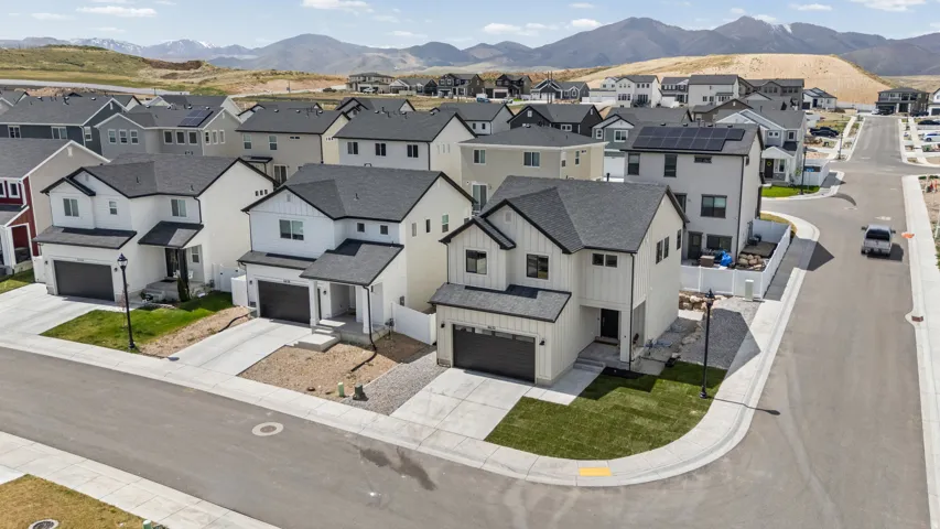 Contemporary two-story residence with a dark asphalt shingle roof