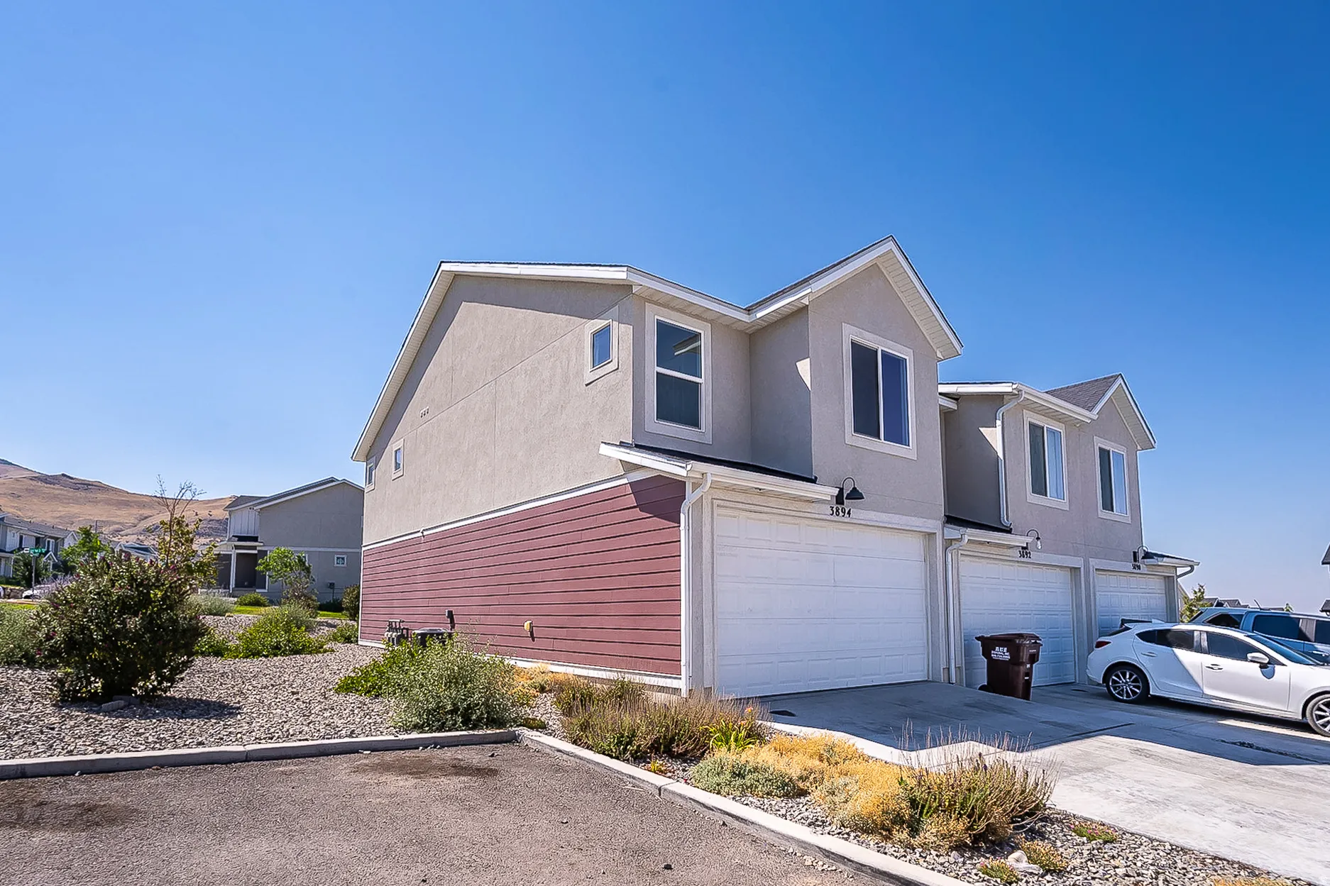 Multi-story residence featuring a stucco and horizontal siding exterior
