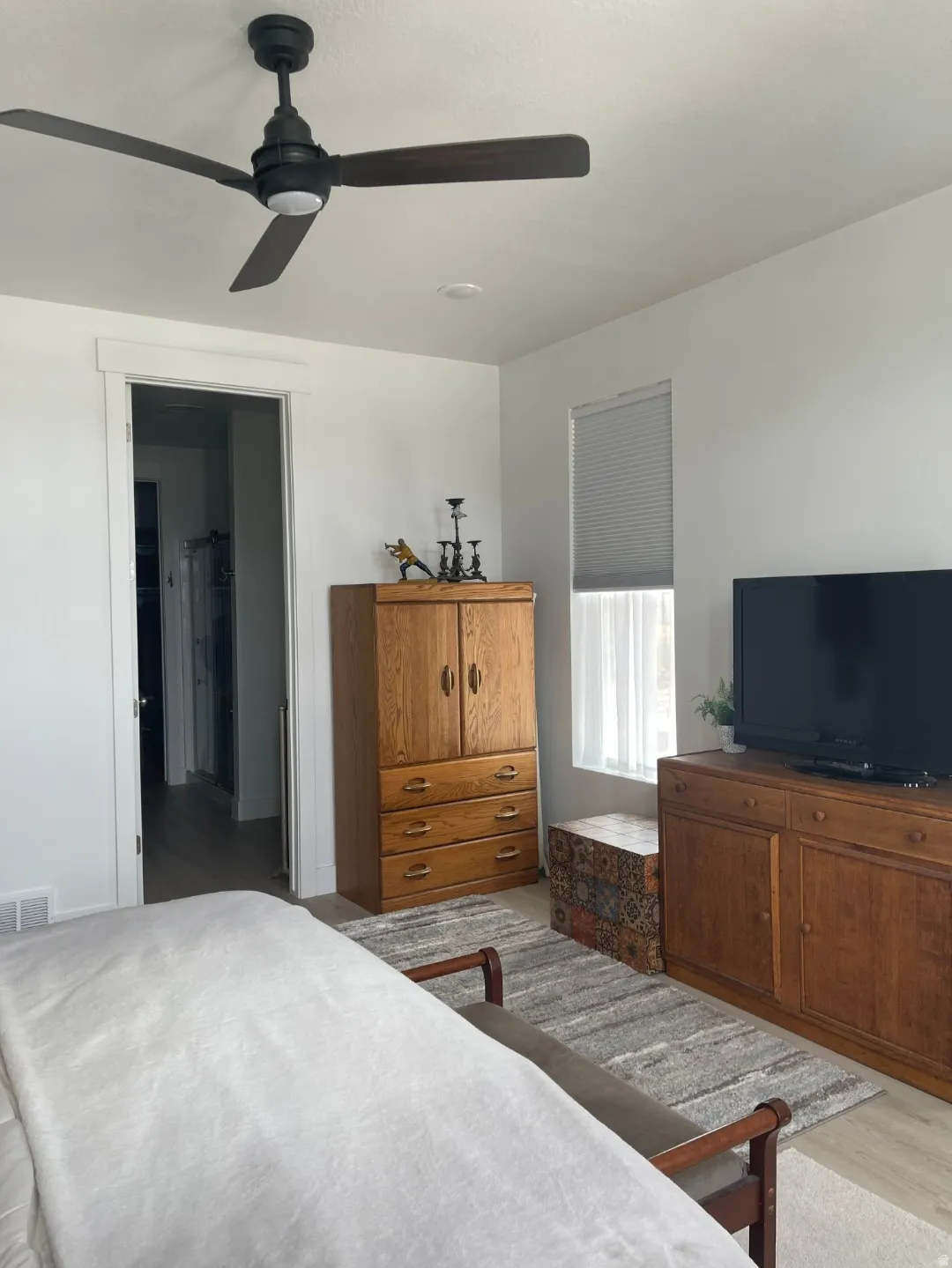 Modern ceiling fan with dark wood-finish blades and integrated lighting