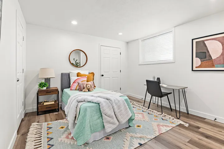 Bedroom featuring wood-finish flooring, recessed lighting, and white baseboards