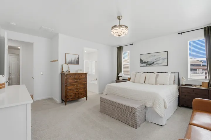 Recessed ceiling fan, carpet flooring, multiple windows with blinds, and white walls
