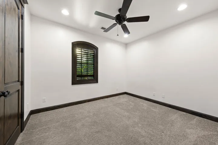 Neutral wall paint and plush carpet flooring