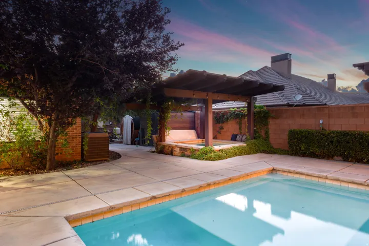 Swimming pool with a perimeter concrete deck and light-colored coping