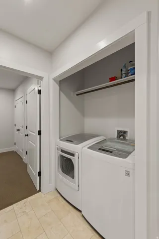Dedicated laundry area with durable tile flooring