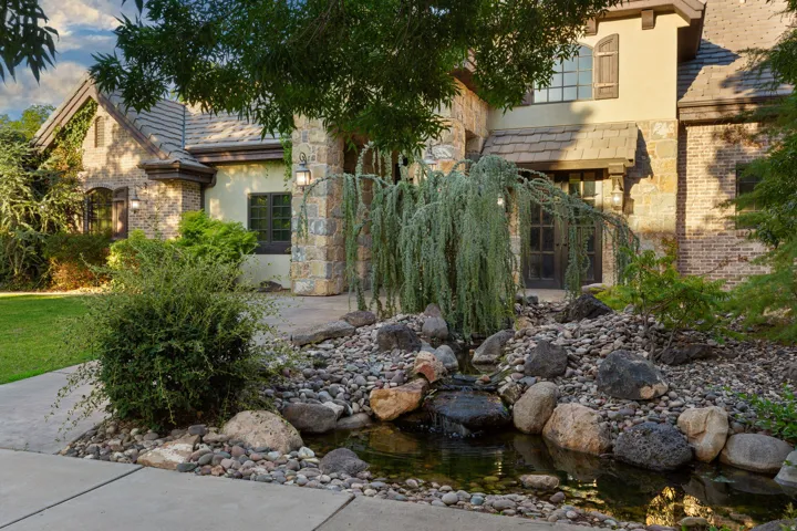 Stone and brick exterior with stucco accents