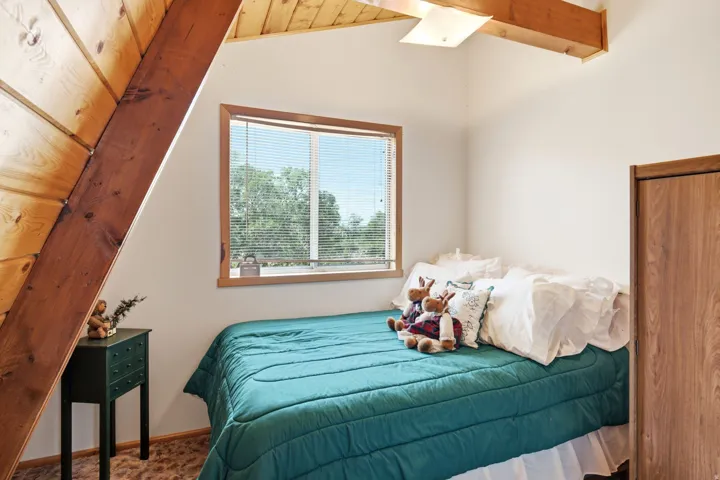 A-frame architectural details featuring exposed wood beams and paneling