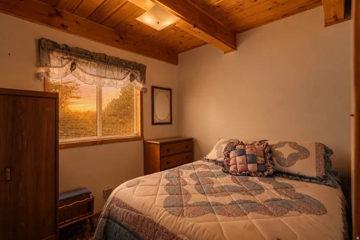 Wood-paneled ceiling with exposed beams