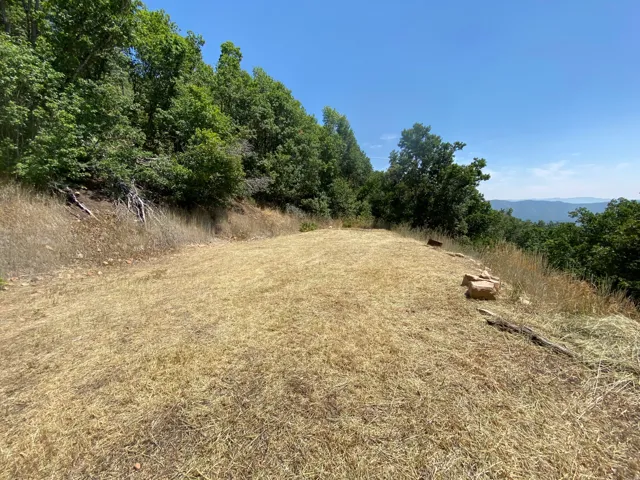 Expansive terraced land with a flat, cleared area