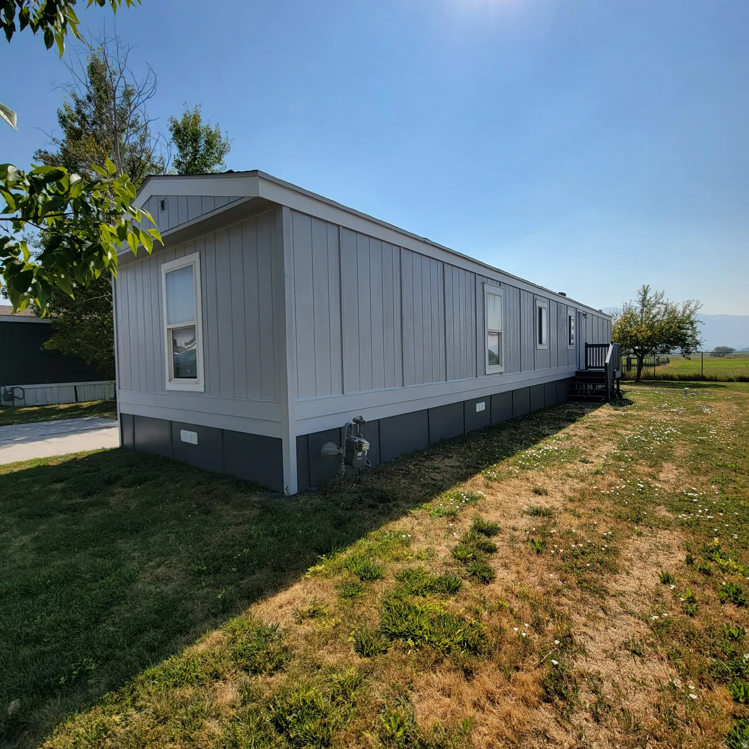 Light gray exterior siding with white trim