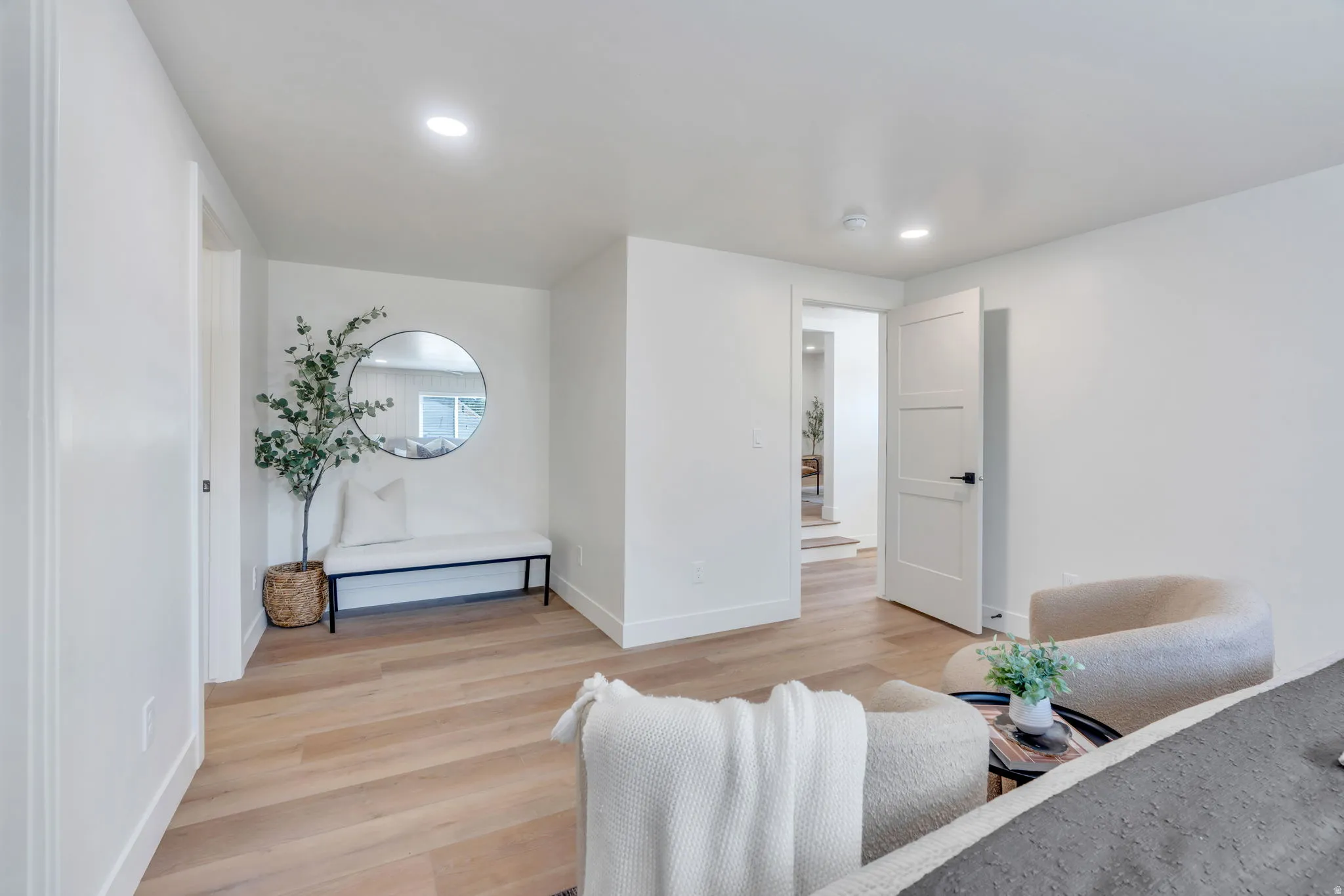 Interior space featuring light wood-finish flooring and recessed lighting