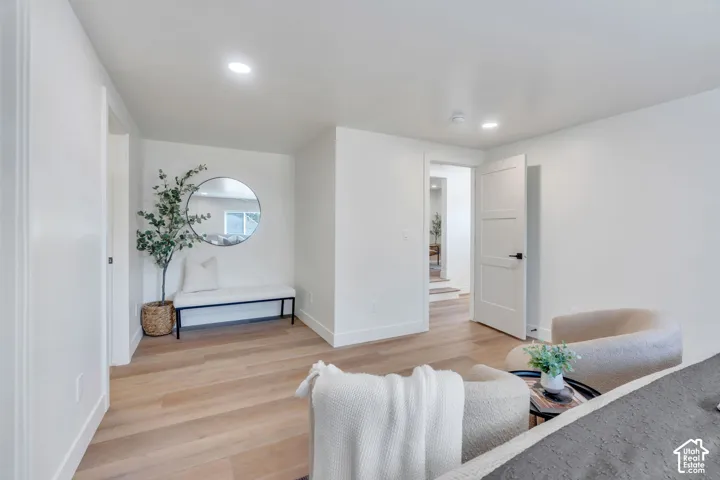 Interior space featuring light wood-finish flooring and recessed lighting
