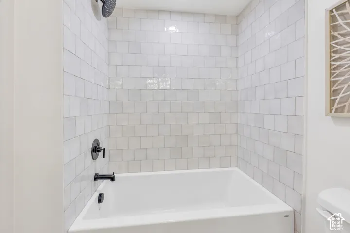 Bathtub and shower combination featuring matte black fixtures