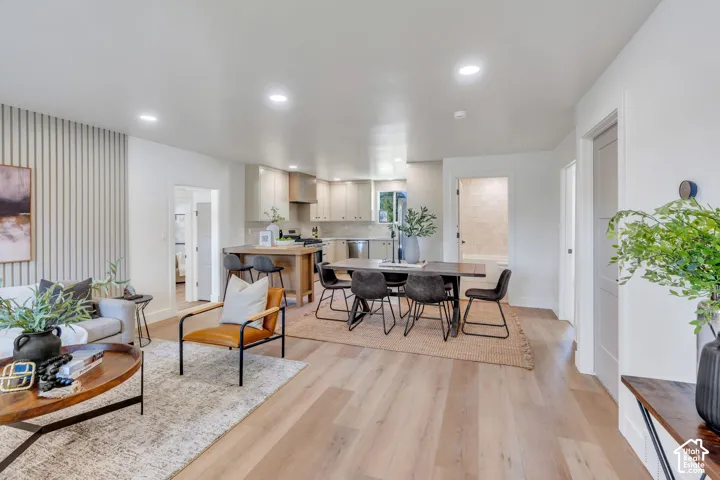 Open-concept living space featuring wood-finish flooring throughout