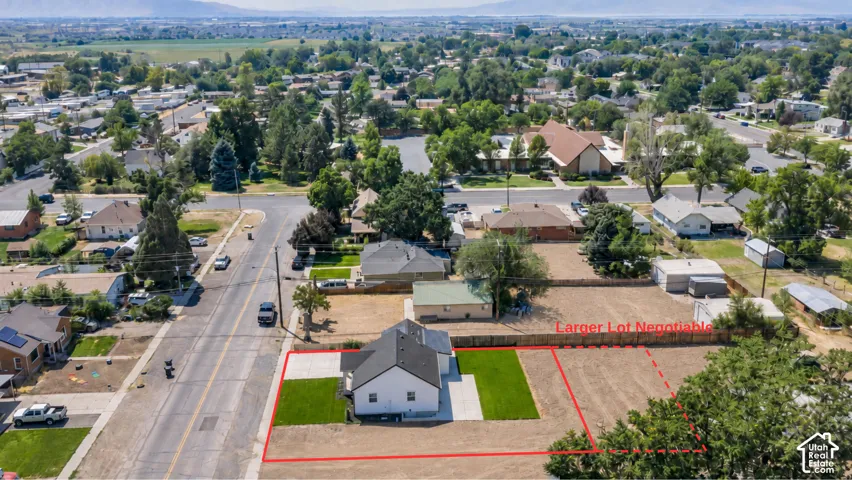 Charming residence situated on an expansive lot featuring a brick-paved entry courtyard, manicured lawn, and mature landscaping