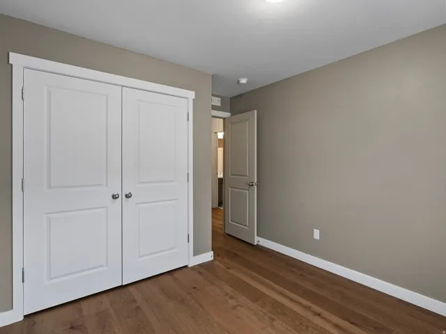 Wood-finish flooring complemented by a neutral wall palette