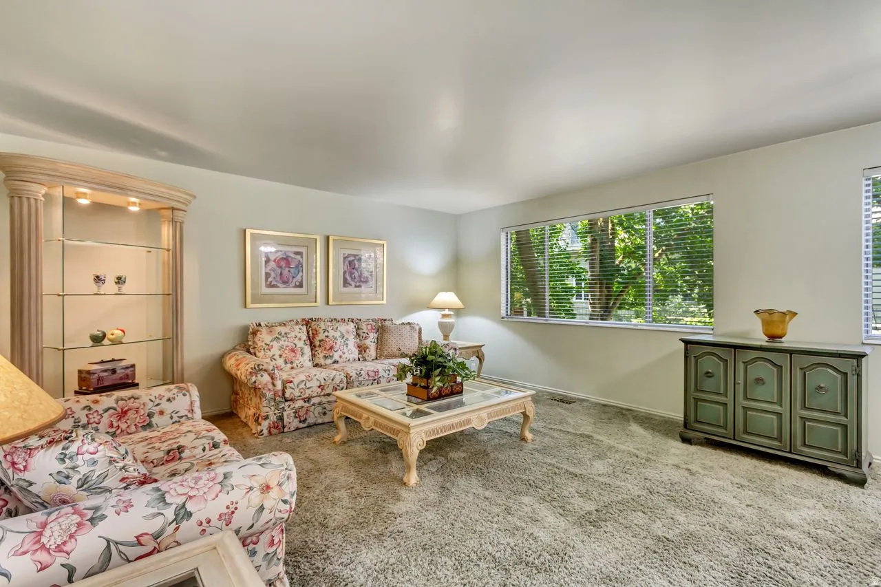 Living area featuring wall-to-wall carpeting and neutral wall paint