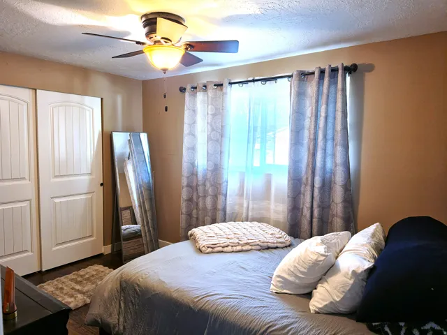 Recessed lighting and ceiling fan overhead provide illumination
