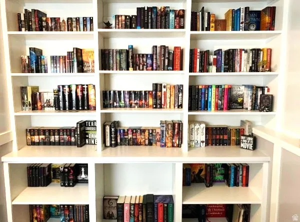 Built-in shelving unit with multiple open shelves and white finish