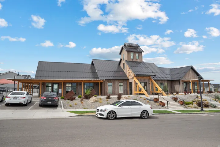 Modern Community building with a dark metal roof and wood siding