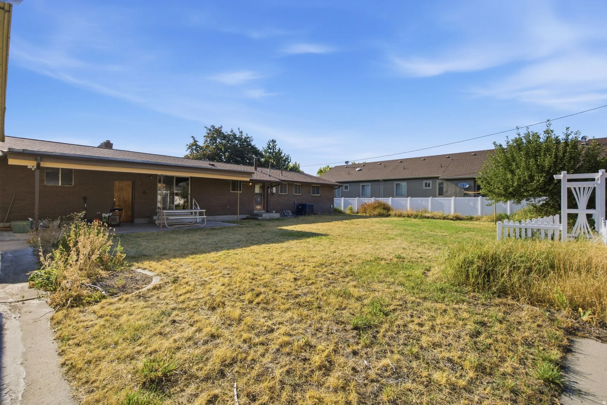 Expansive level lot with mature landscaping and established grounds