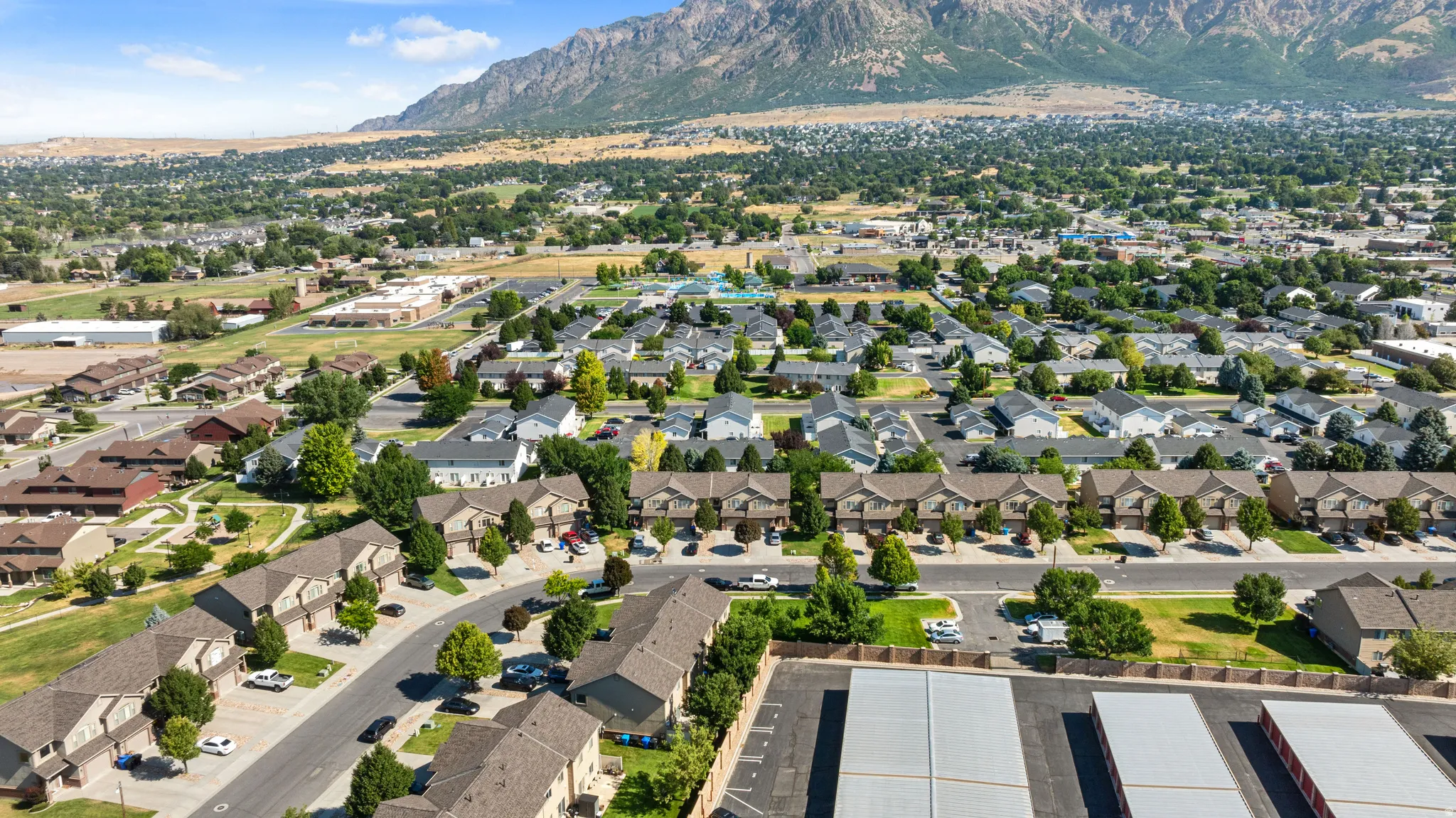 Expansive neighborhood featuring residential homes, townhomes, and a mountainous backdrop