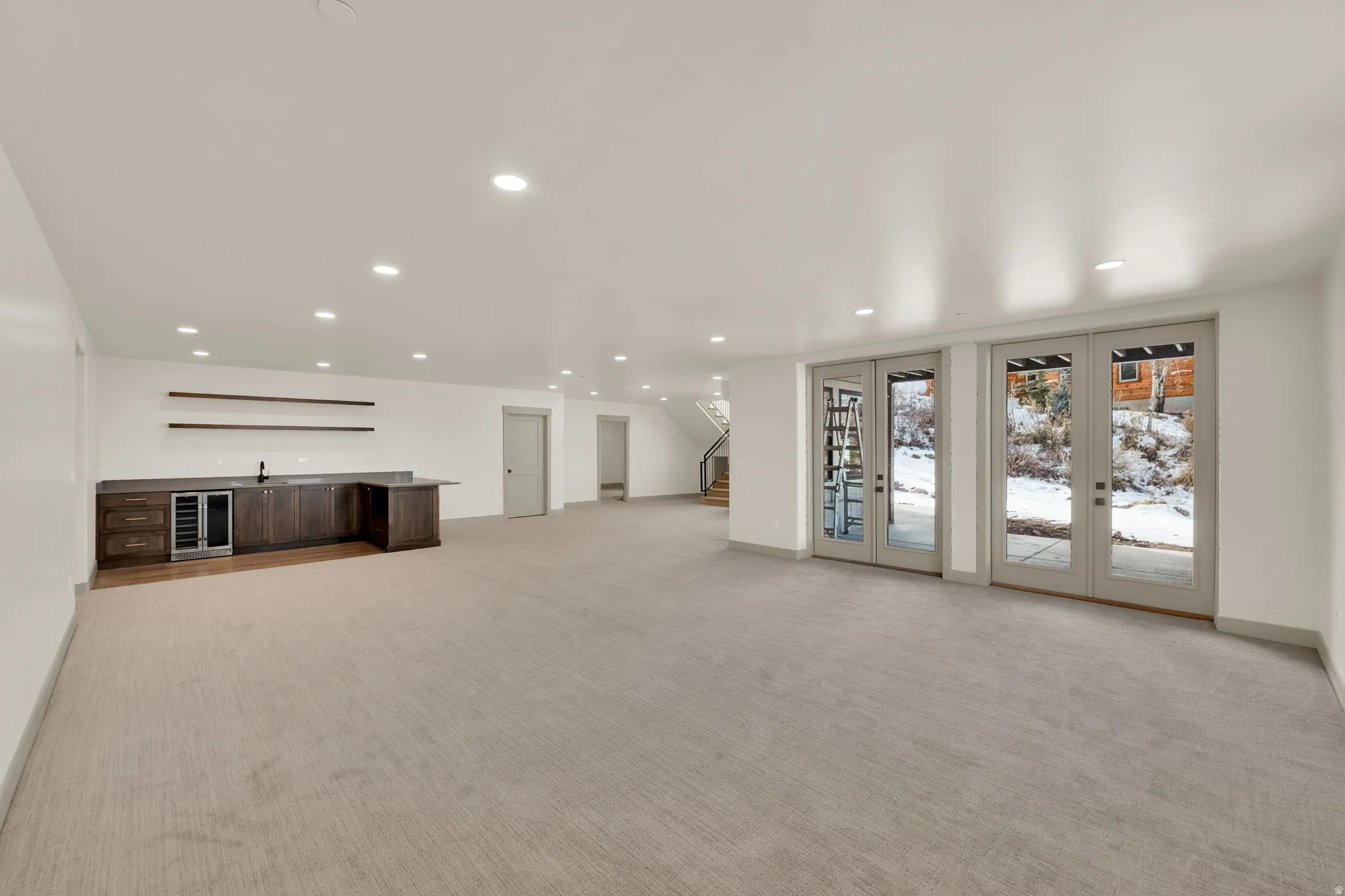 Family room with wet bar and walk-out to covered patio and hot tub patio