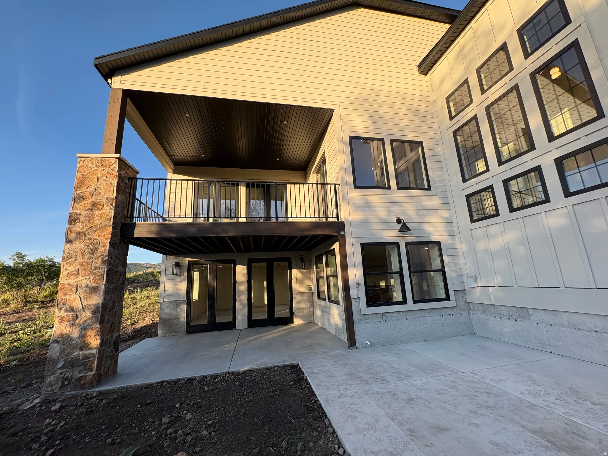 Exterior view of covered deck, covered patio and hot tub patio