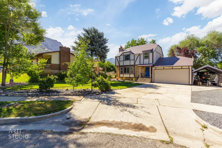 Charming Tudor-style residence featuring a distinctive half-timber exterior and peaked roofline