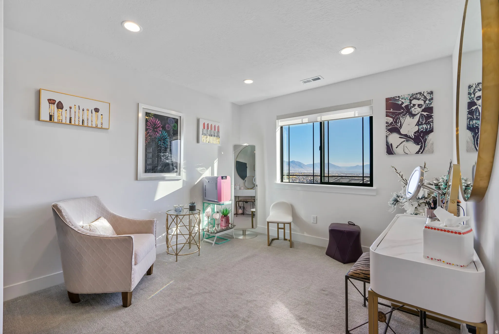 Carpeted interior space featuring white walls and recessed lighting