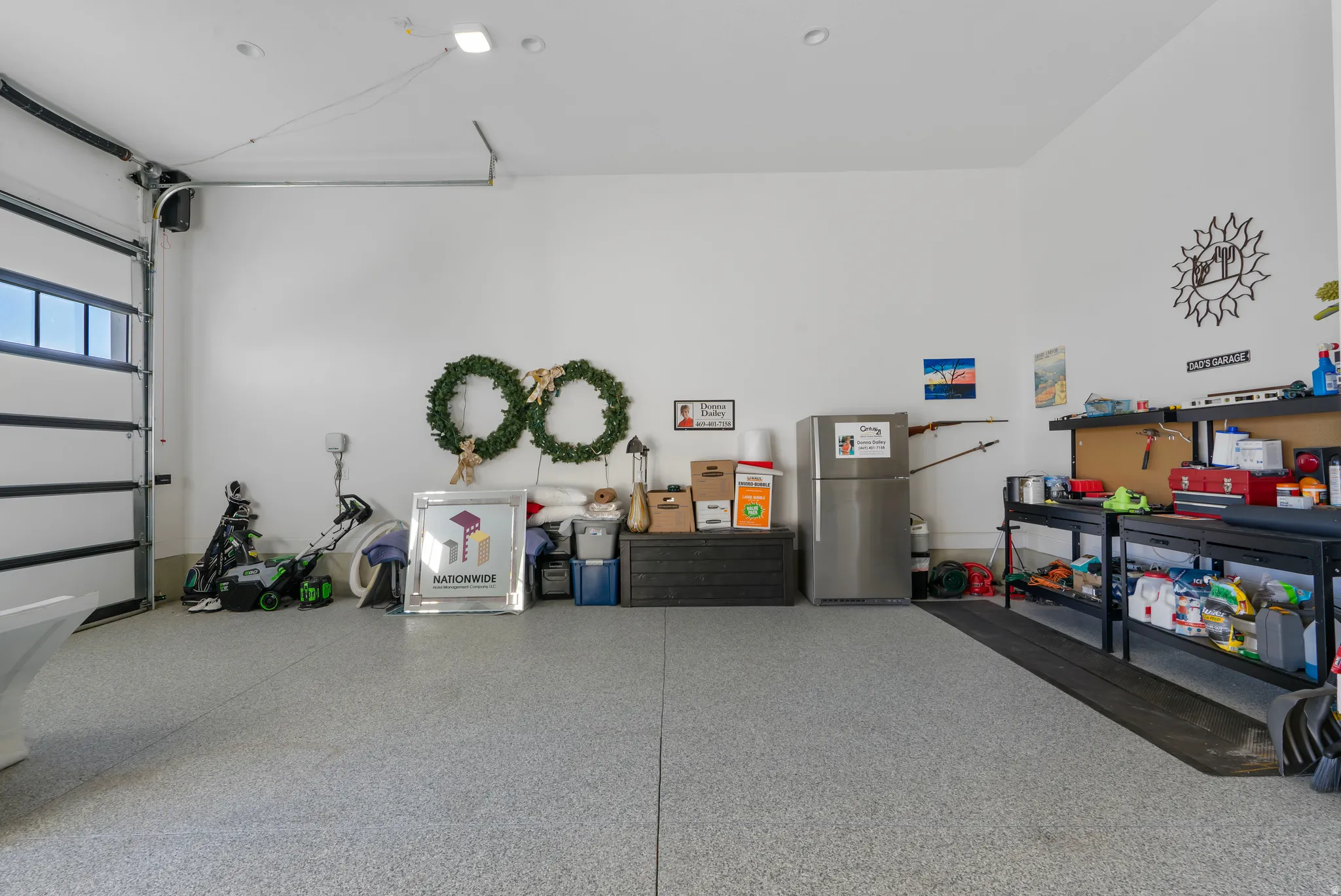 Spacious garage with epoxy-coated flooring and white walls