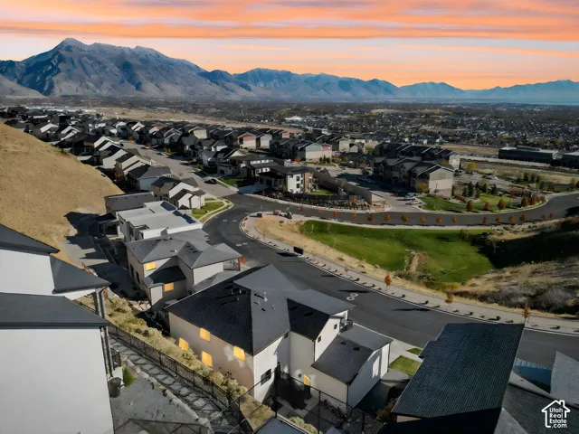 Sweeping mountain backdrop frames a residential community with varied architectural styles
