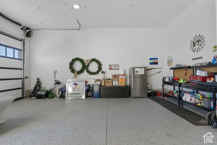 Spacious garage with epoxy-coated flooring and white walls