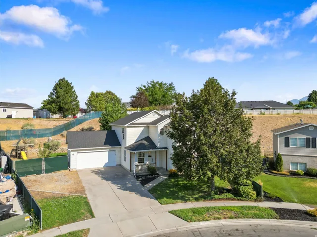 Two-story residence with a two-car garage and concrete driveway
