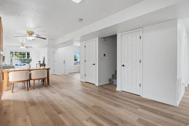 Open floor plan featuring wood-finish flooring and white painted walls