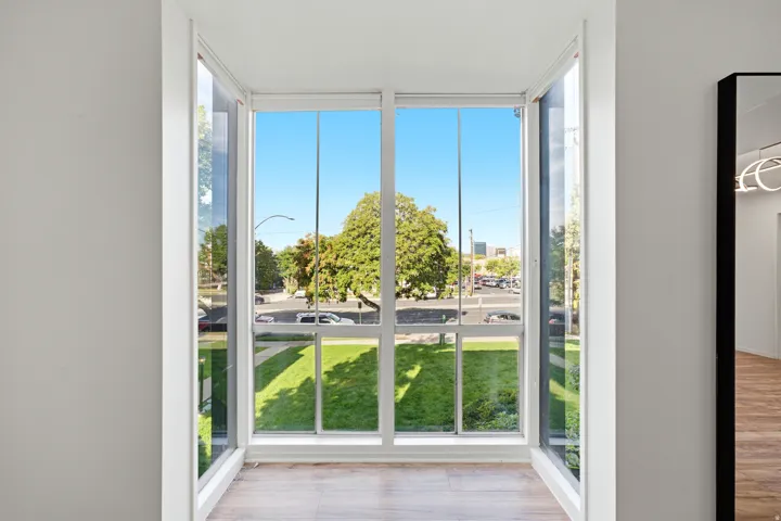 Expansive bay window with multiple panes and white framing