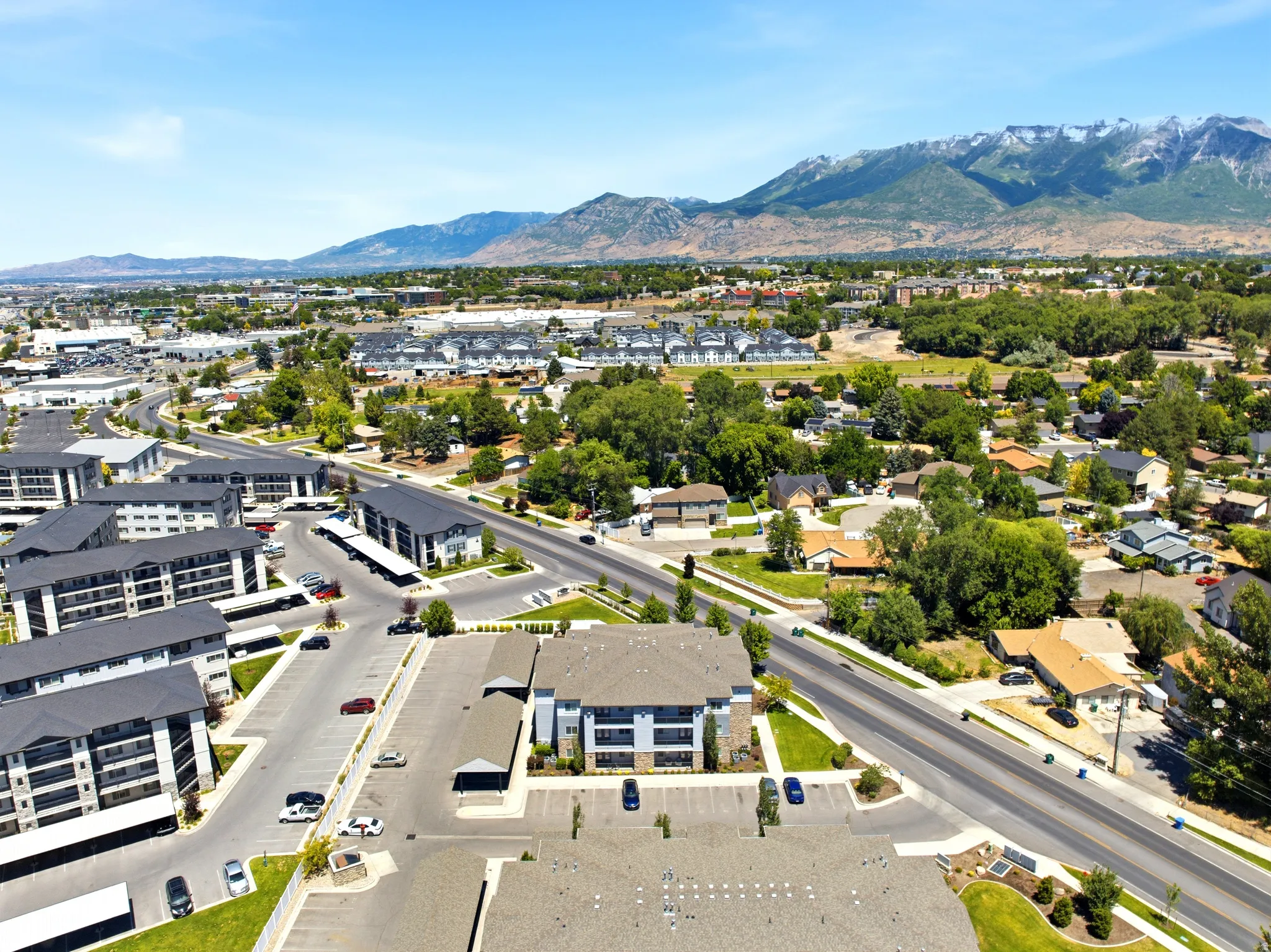Expansive aerial perspective showcasing a developed community with a prominent mountainous backdrop