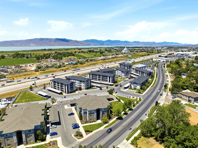 Aerial perspective showcasing multiple residential buildings with varied architectural styles